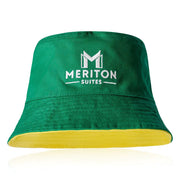 Green bucket hat with Meriton Suites logo on a white background. Shop Meriton Suites.