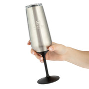 Hand holding a silver and black insulated tumbler with a brand logo on a white background