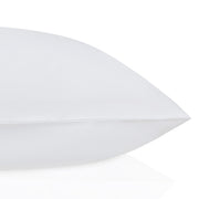 White pillow on a white background. The Lad Collective bed linen from Shop Meriton Suites.