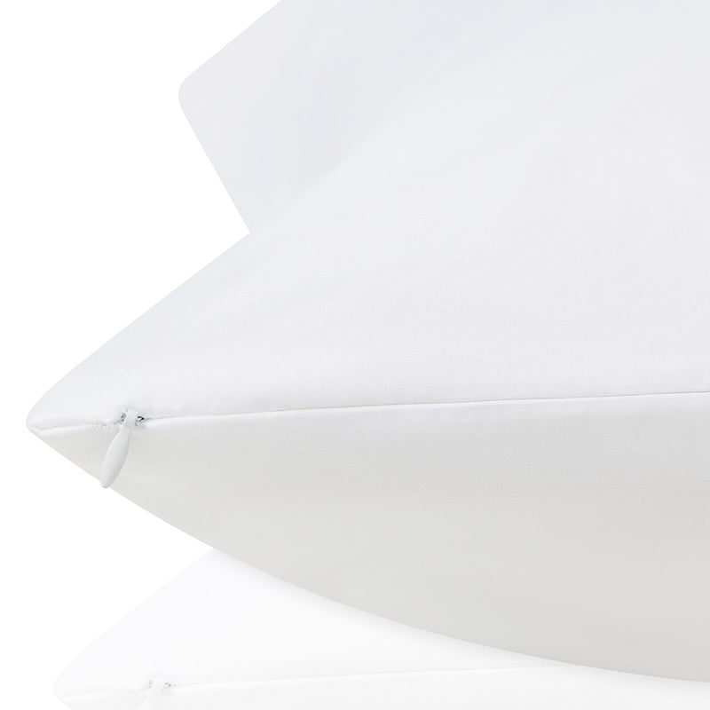 Close-up of a white pillow on a white background.  The Lad Collective bed linen from Shop Meriton Suites.