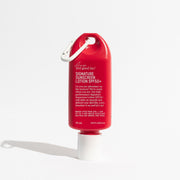 Red sunscreen lotion bottle with carabiner on a white background. Shop Meriton Suites. We are feel good inc. spf sunscreen.
