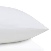 White pillow on a white background.  The Lad Collective bed linen from Shop Meriton Suites.