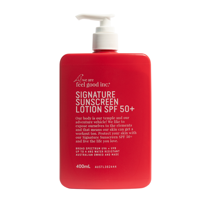 A 400mL red pump bottle of We Are Feel Good Inc. Signature Sunscreen Lotion SPF 50+ on a solid white background. Shop Meriton Suites. We are feel good inc. spf sunscreen.