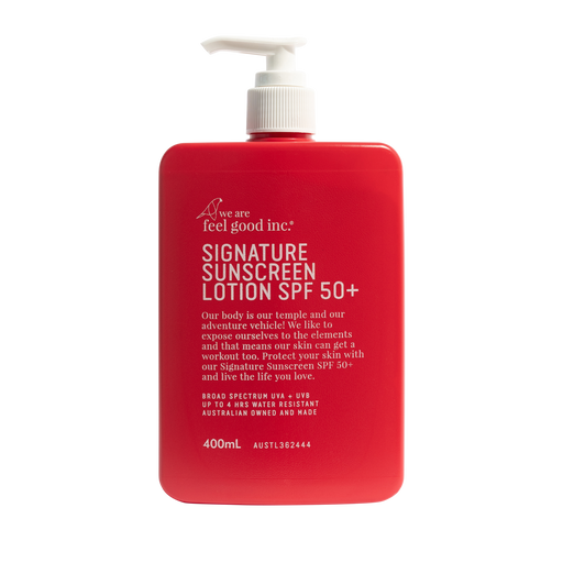 A 400mL red pump bottle of We Are Feel Good Inc. Signature Sunscreen Lotion SPF 50+ on a solid white background. Shop Meriton Suites. We are feel good inc. spf sunscreen.