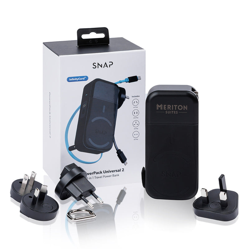 MERITON SUITES SNAPwirless Universal 2 in 1 Travel Power Bank set, featuring a black power bank, multiple plug adapters, a cable, and the original white and black retail box.