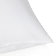 White pillow on a white background.  The Lad Collective bed linen from Shop Meriton Suites.