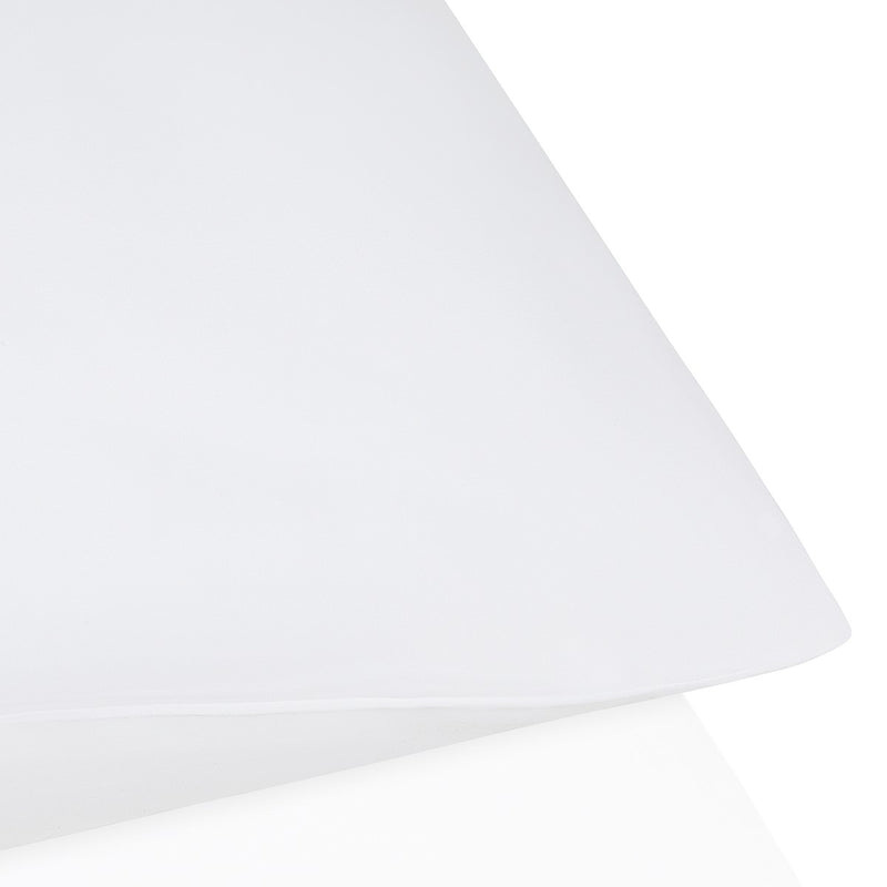 White lampshade on a white background.  The Lad Collective bed linen from Shop Meriton Suites.