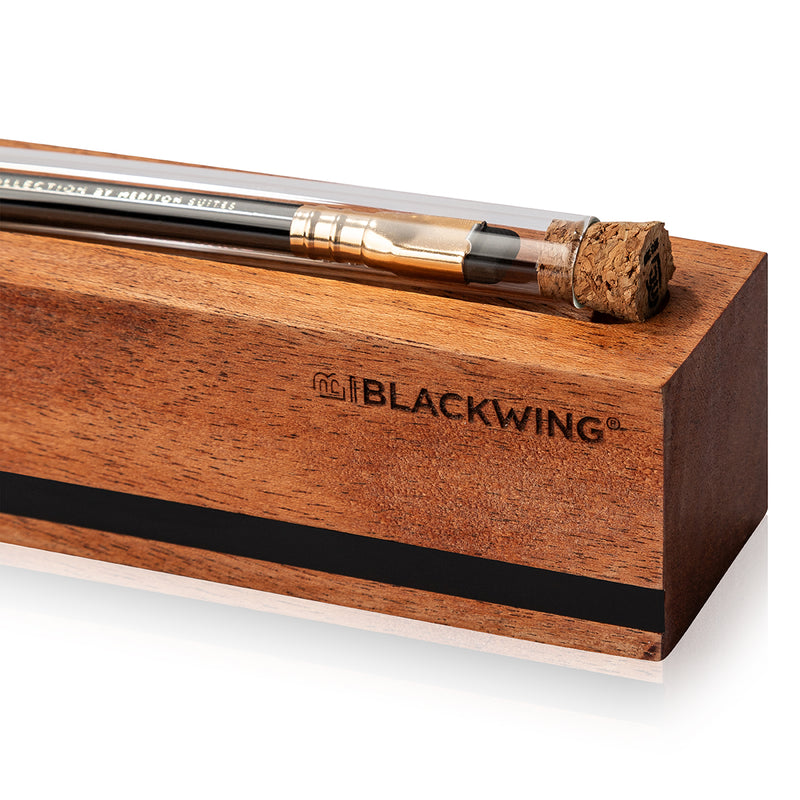 Blackwing pencil in a wooden holder on a white background