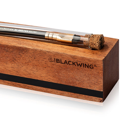 Blackwing pencil in a wooden holder on a white background