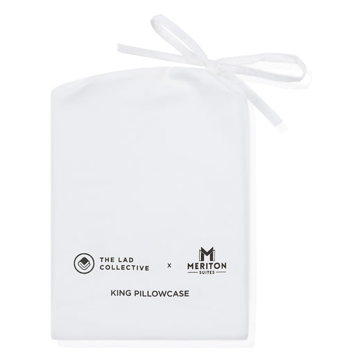 White king pillowcase with 'The Lad Collective' and 'Meriton Suites' branding on a white background.